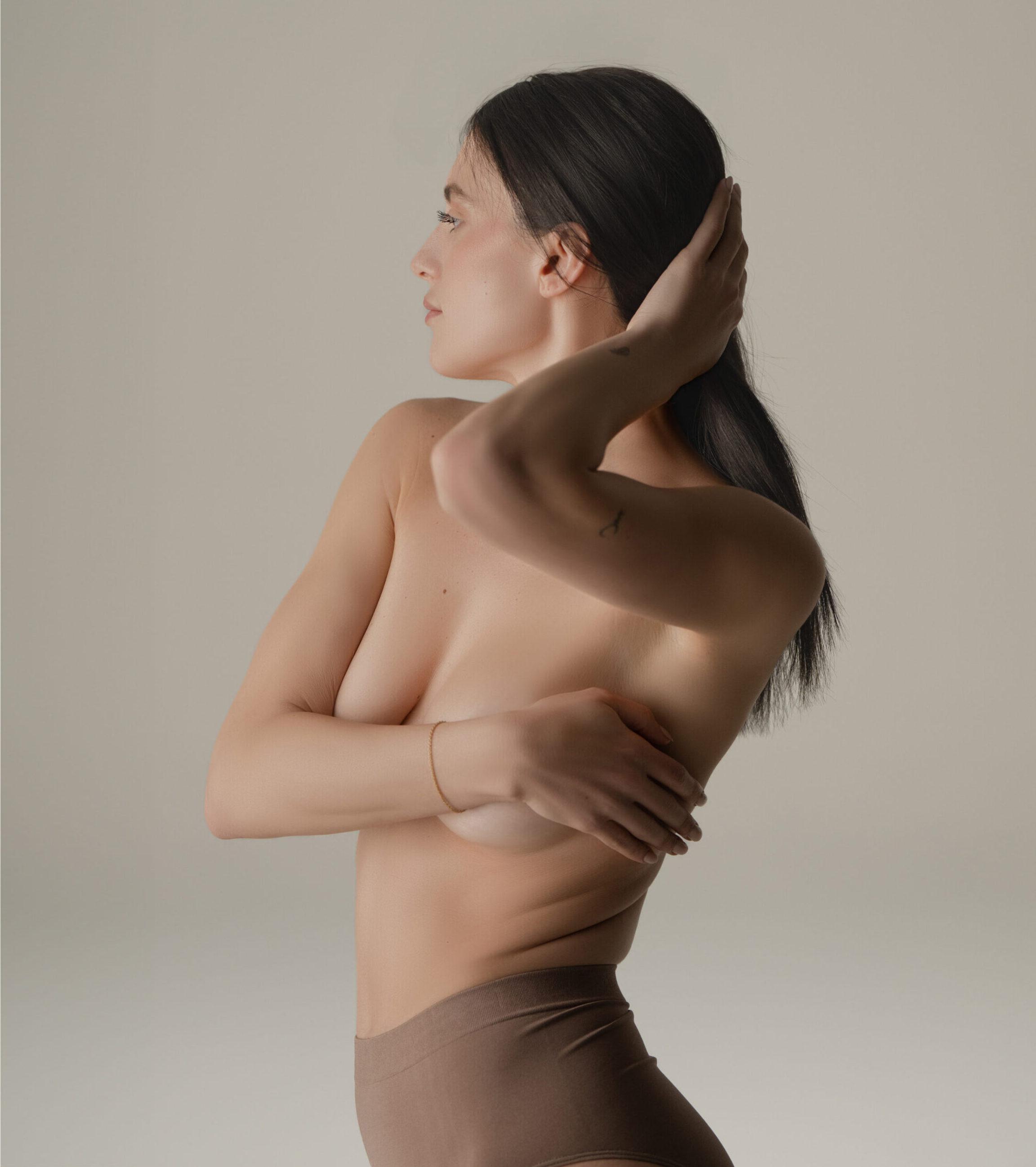 Breast augmentation patient in muted lighting